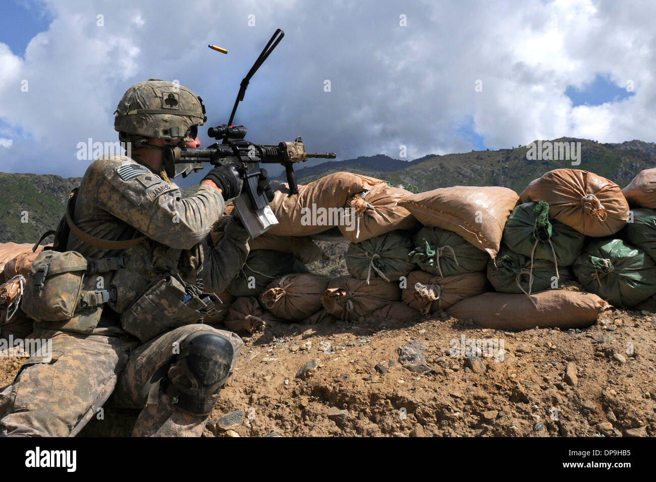U.S. soldier shoots at the enemy during a more than three-hour firefight, Afghanistan Stock Photo