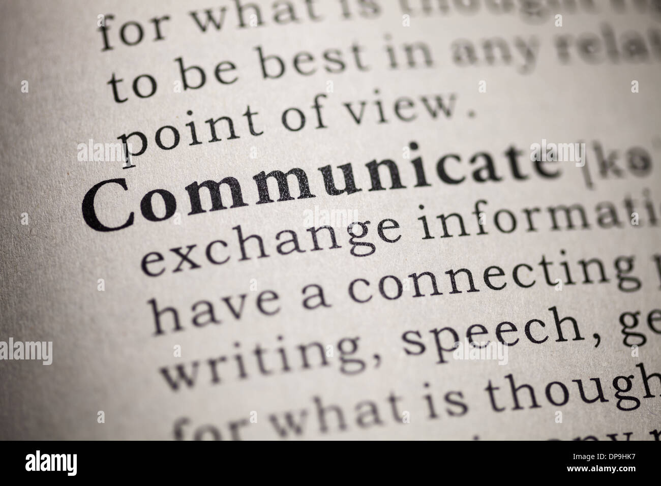 Fake Dictionary, Dictionary definition of the word communicate. Stock Photo