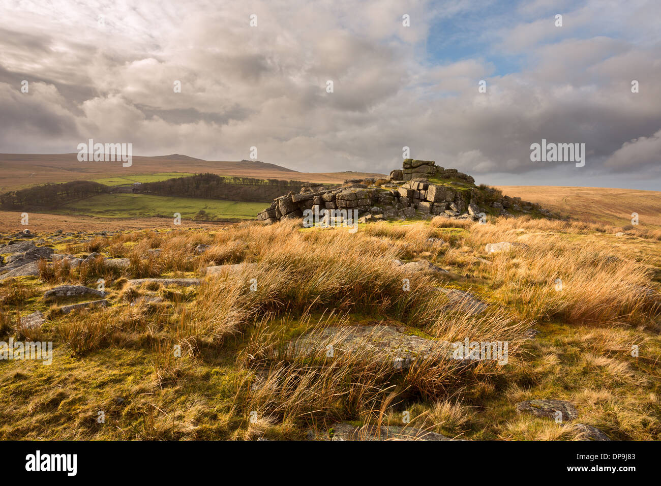 Storm clouds at Winter Tor with views towards Yes Tor, Dartmoor National Park Devon Uk Stock Photo
