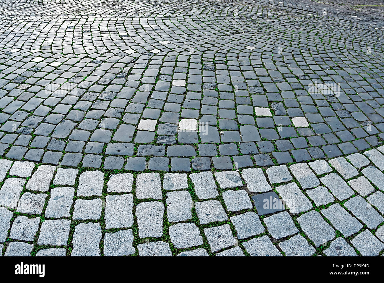Detail of cobblestone sidewalk made of cubic stones. Stock Photo