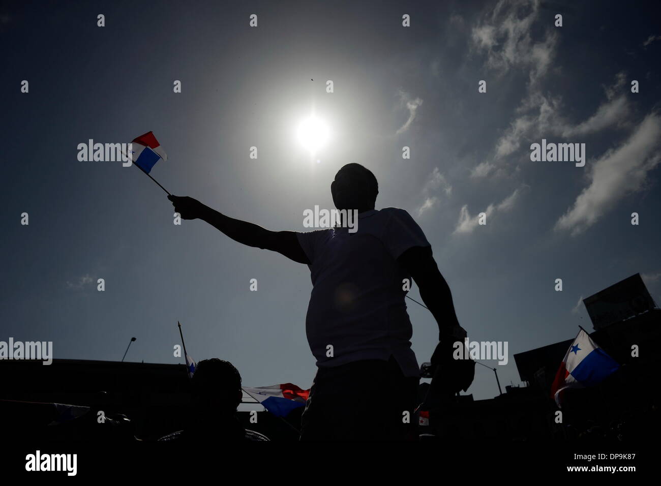 Panama City, Panama. 09th Jan, 2014. A man waves a Panamanian flag during the commemoration of the Martyrs' Day, in Panama City, capital of Panama, on Jan. 9, 2014. The Martyrs' Day was a movement occurred in Panama on Jan. 9, 1964, when troops of the U.S. Army clashed with high school students who demanded the right to raise the national flag in the area known as Canal Zone, a strip of land around the Panama Canal, which was ceded to the United States of America in perpetuity as a result of the Hay-Bunau-Varilla Treaty. Credit:  Mauricio Valenzuela/Xinhua/Alamy Live News Stock Photo