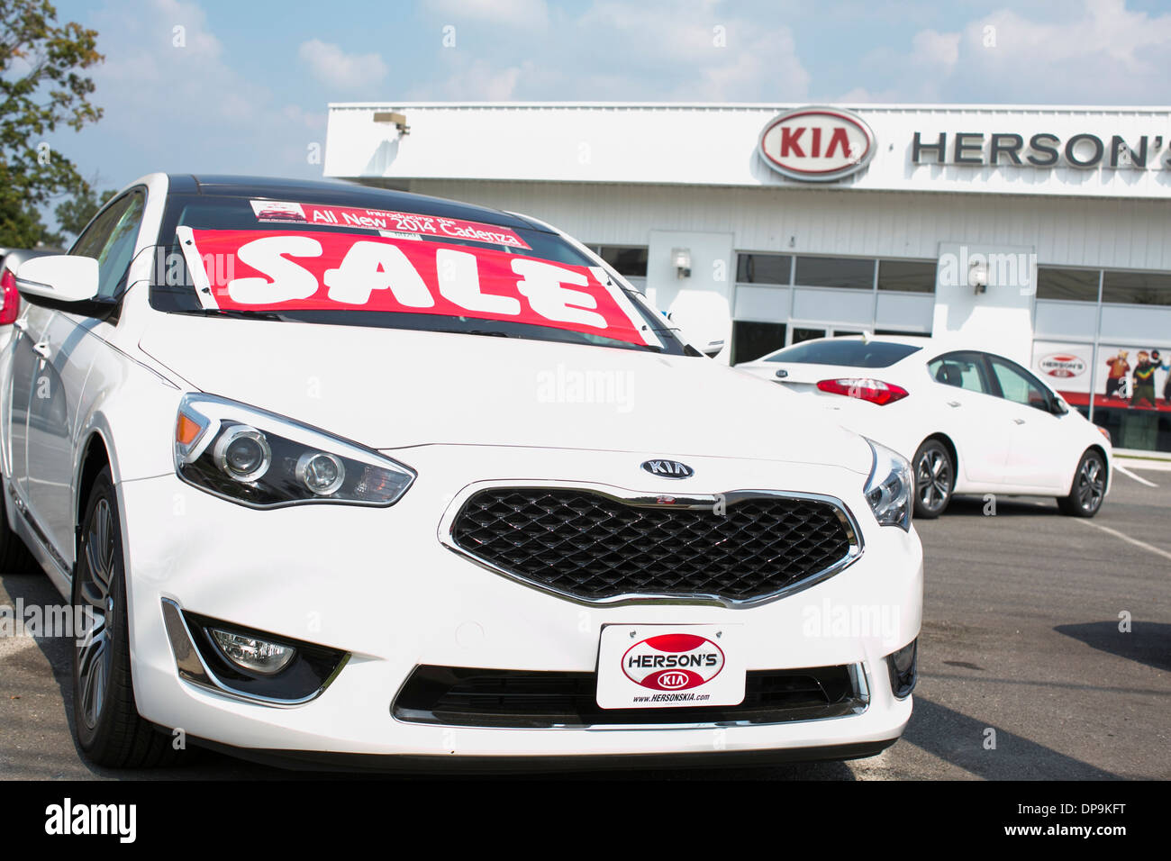 A Kia dealer lot in suburban Maryland.  Stock Photo