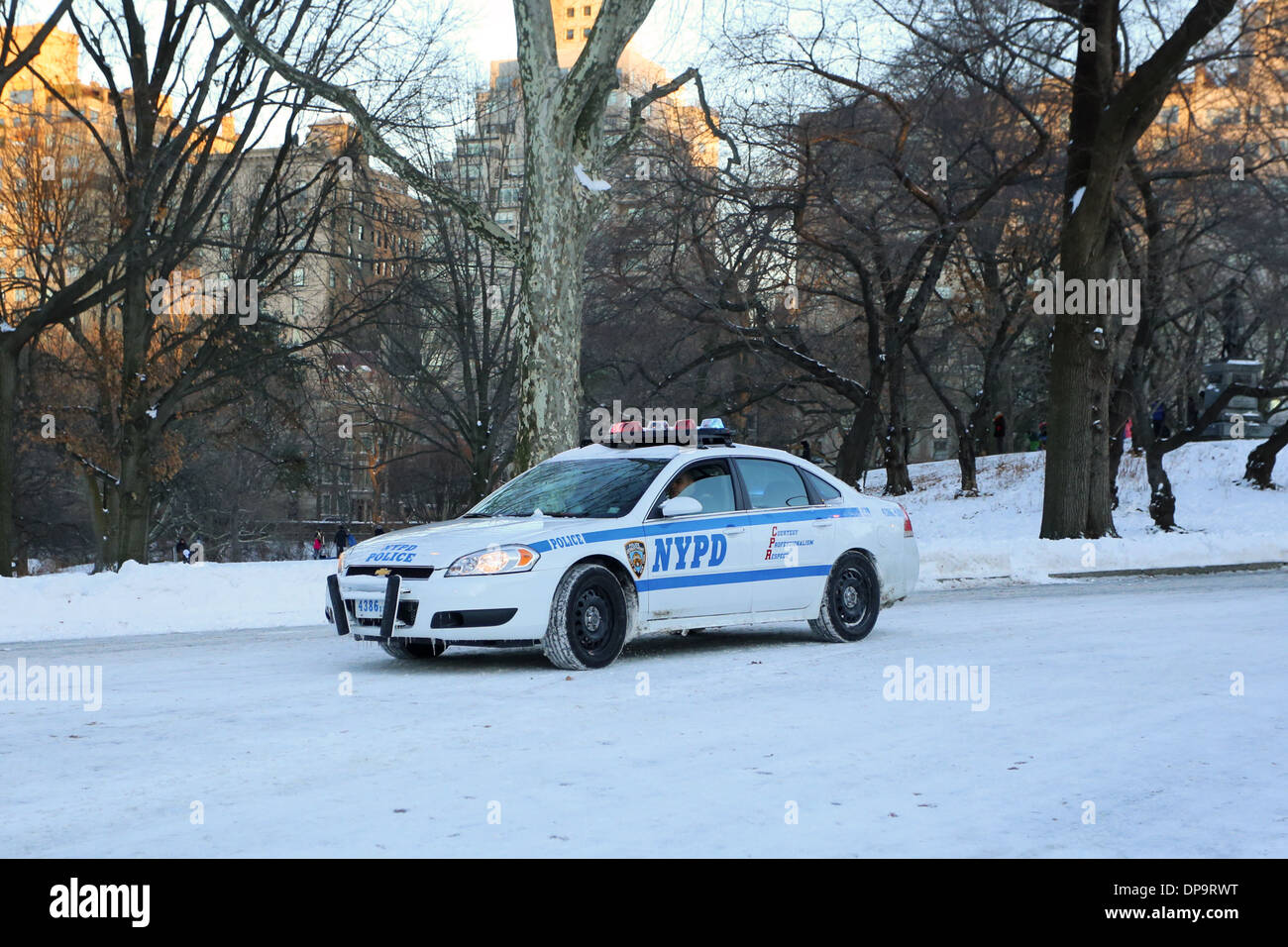A NYC police car on a snow covered roadway Stock Photo