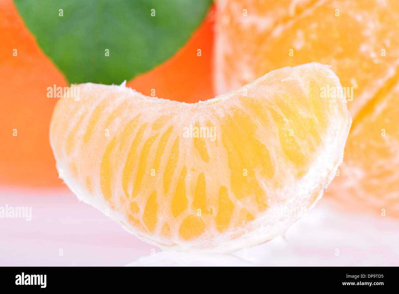 To clean tangerine. To remove a peel from tangerine. Cleaning of a madarin  of a peel. Food Stock Photo - Alamy