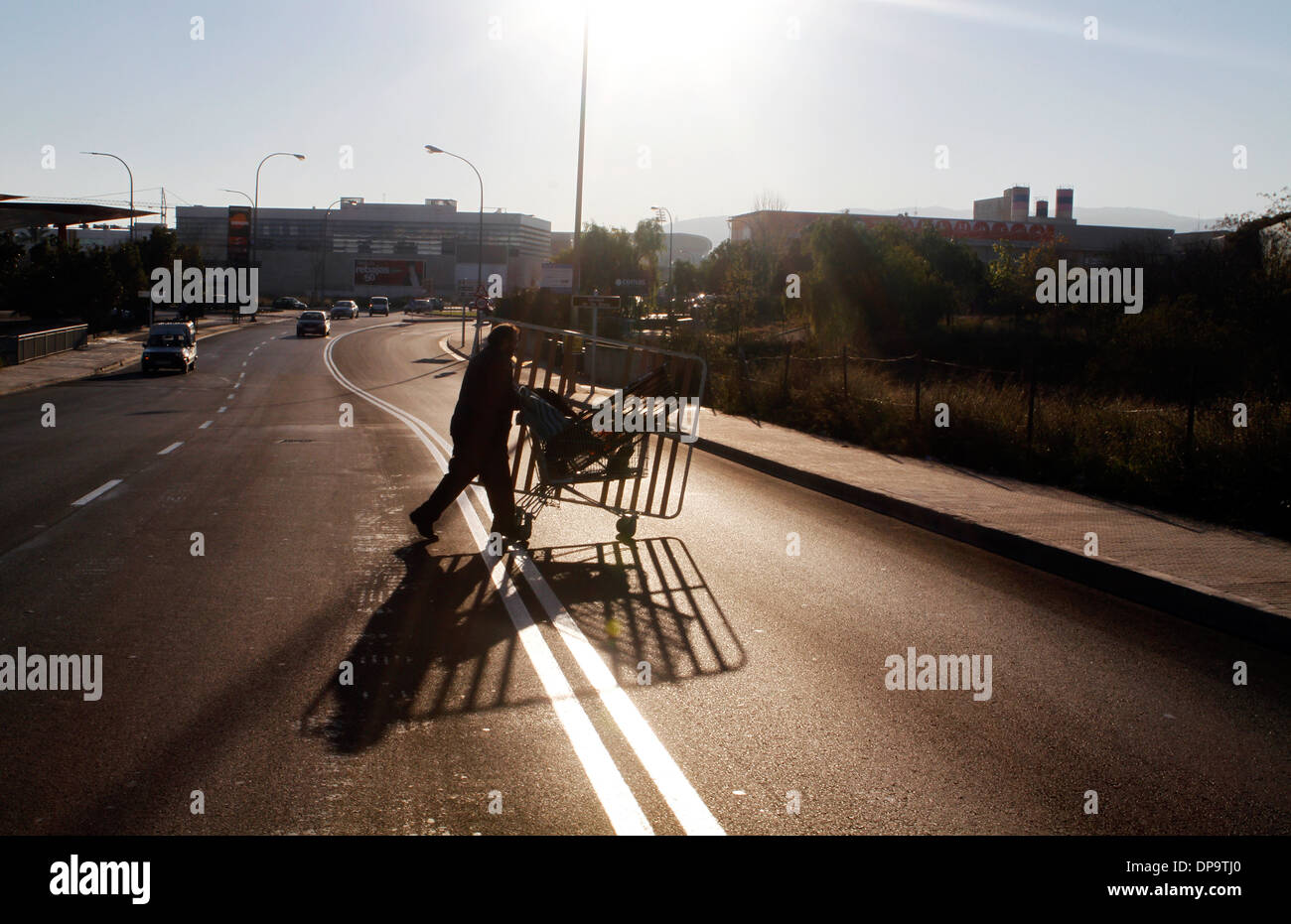 A junkman pushes his trolley where he picks between the junk copper, iron and steel to seel on local junkyards, Mallorca, Spain Stock Photo