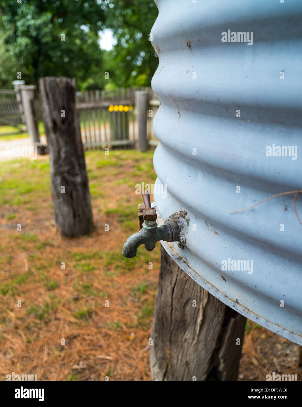 Tap on a old water tank. Stock Photo