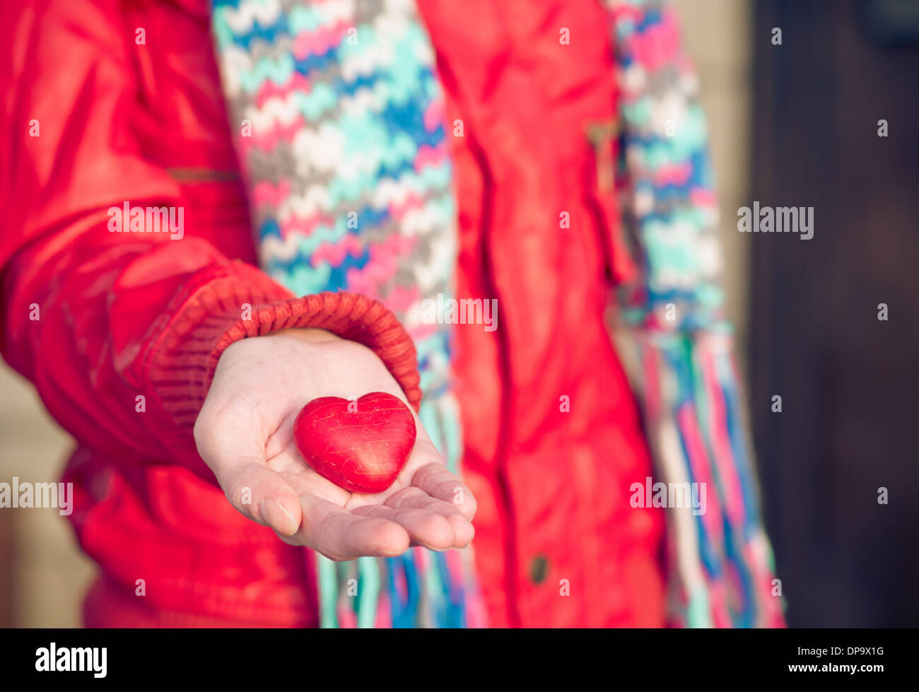 Heart shape love symbol in woman hands Valentines Day romantic greeting people relationship concept winter holiday Stock Photo