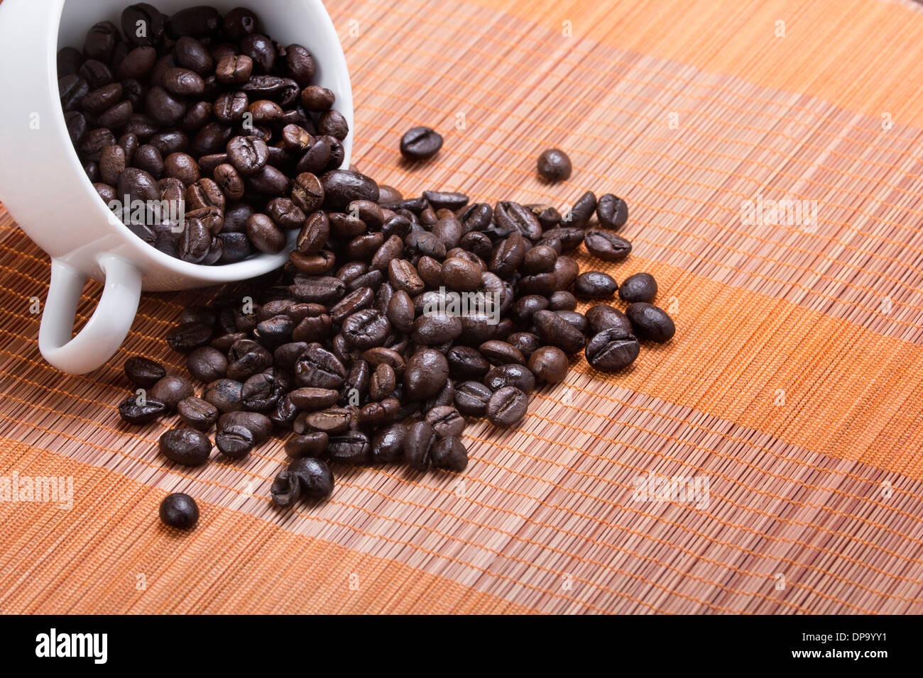 coffee bean cup spill over on wood table pattern Stock Photo