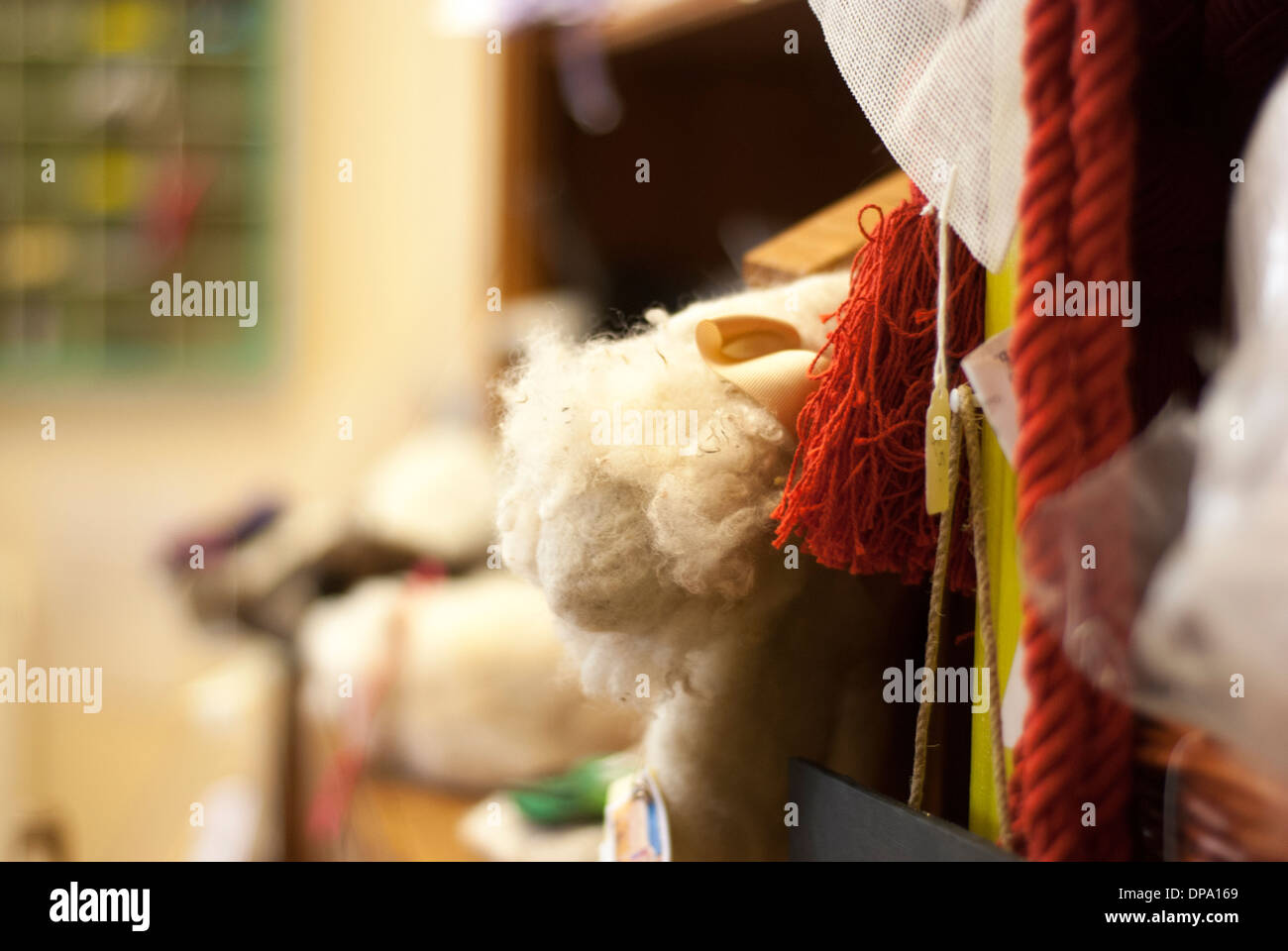 A clutter of multi coloured haberdashery, threads, yarns and wool with room for text Stock Photo
