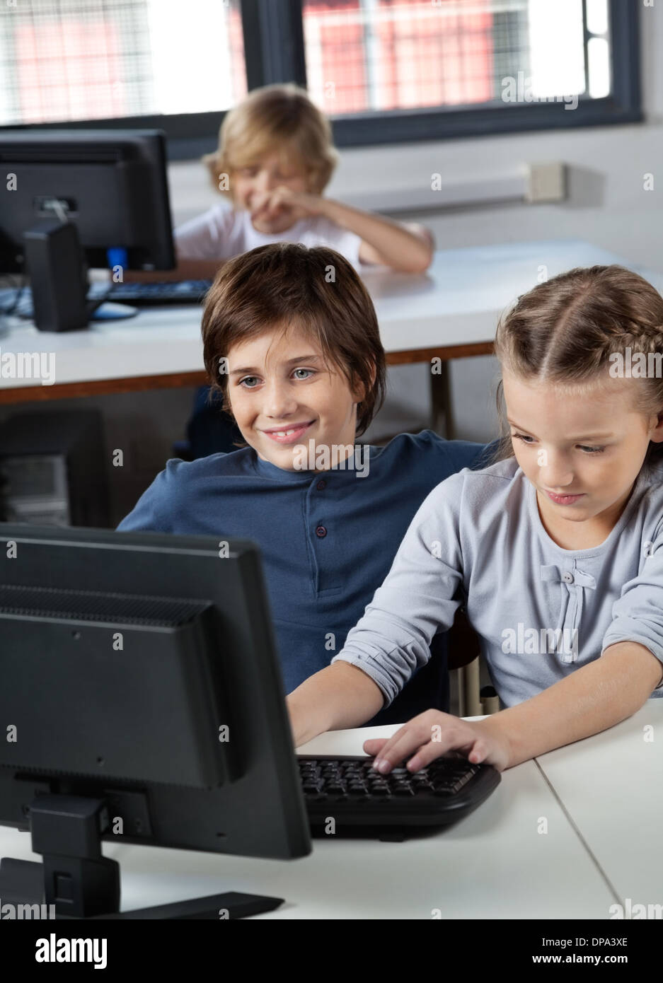 Little Boy And Girl Using Desktop Pc Stock Photo - Alamy