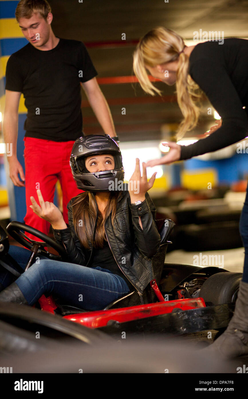 Teenage girl sitting in go cart after accident Stock Photo