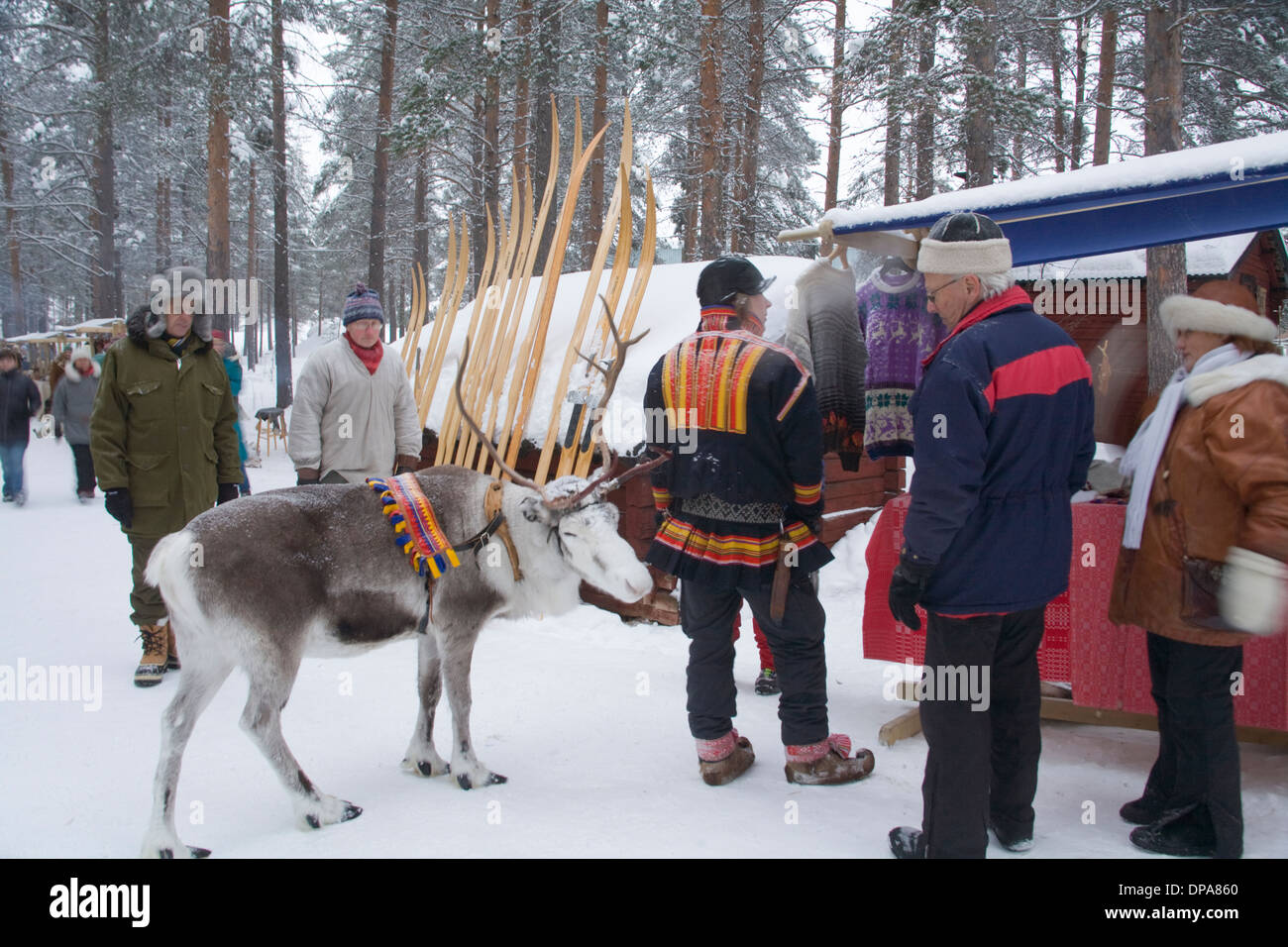 Reindeer and Same at Jokkmokk Historic Fair Sweden Winter Stock Photo