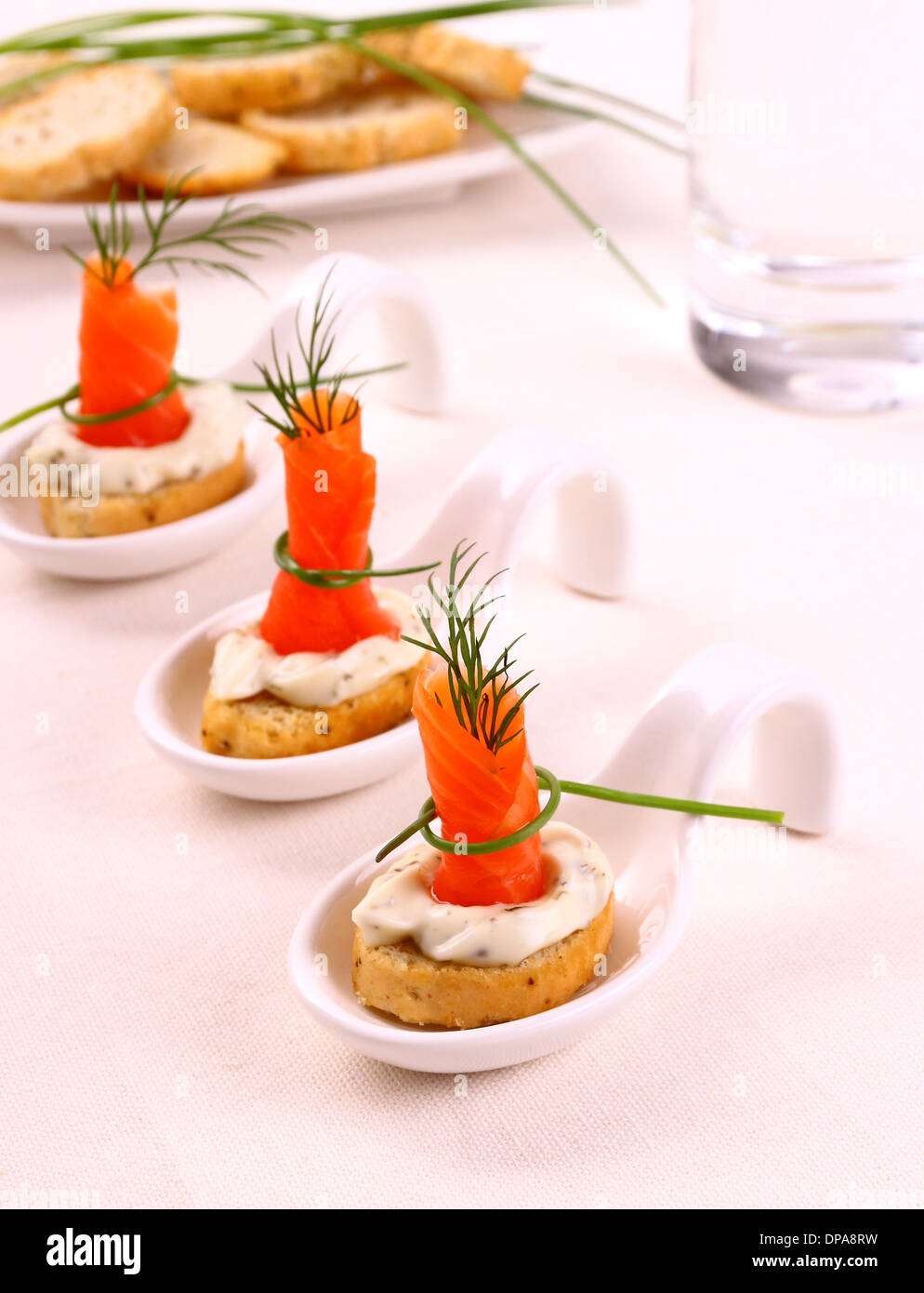 Smoked salmon roll on white bread and remoulade, close up Stock Photo