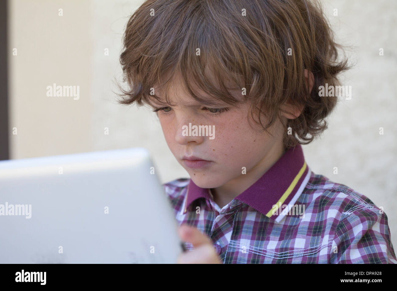 Boy using digital tablet Stock Photo