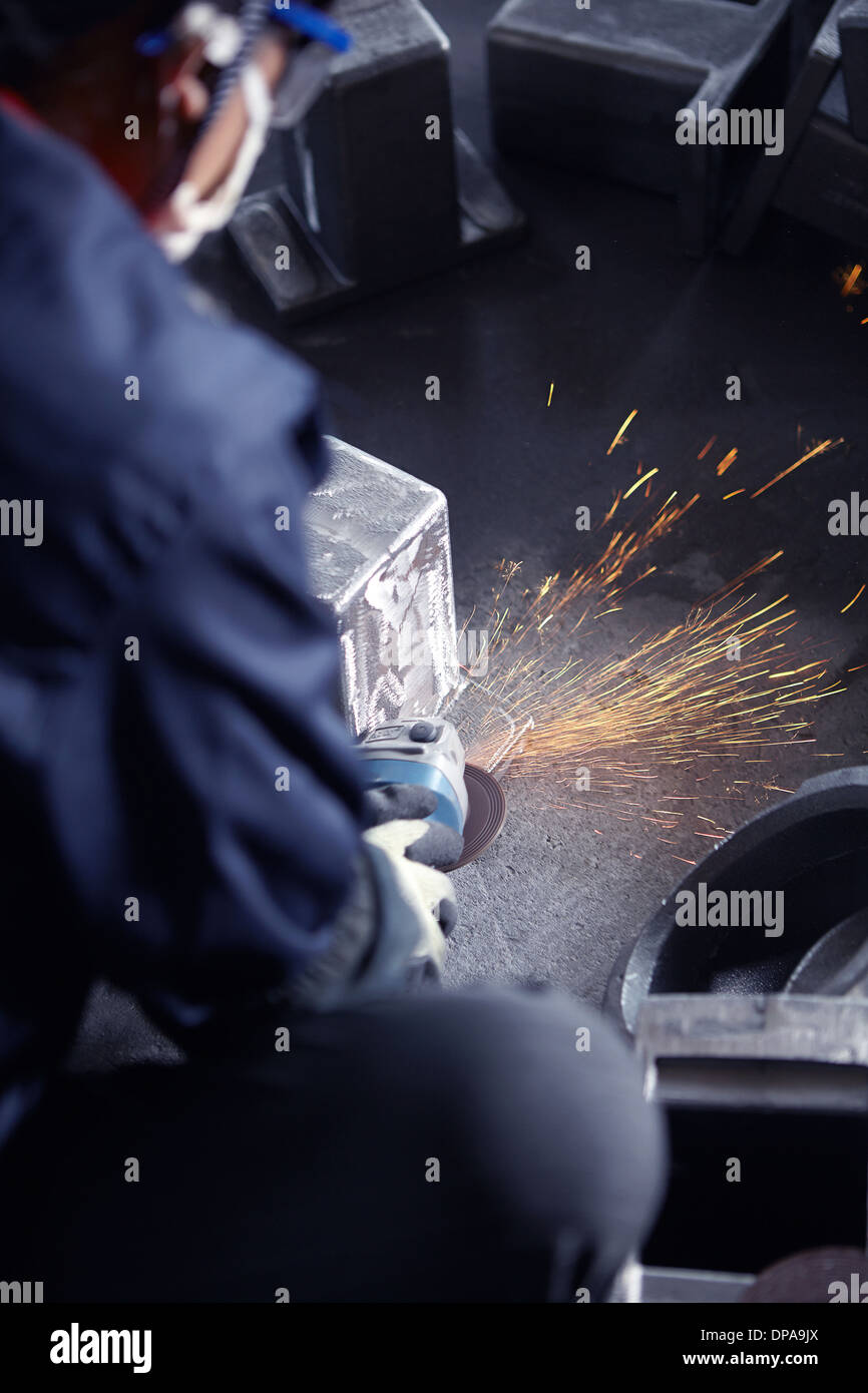 Grinding in cast iron foundry Stock Photo Alamy