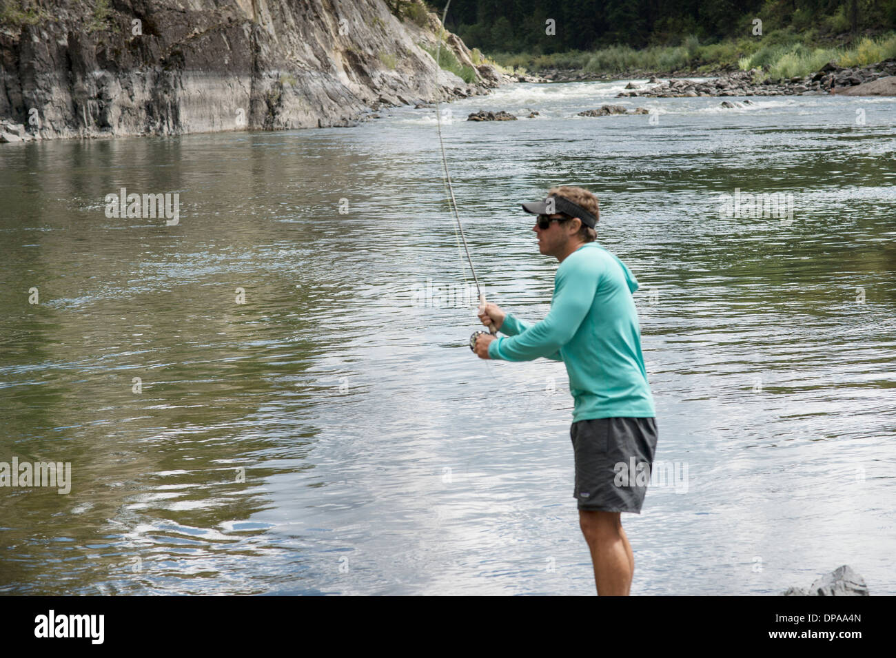 Man fly fishing in the Clark Fork River in Montana. Stock Photo