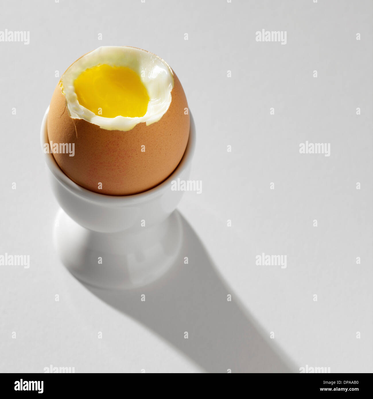 Boiled egg in egg cup Stock Photo