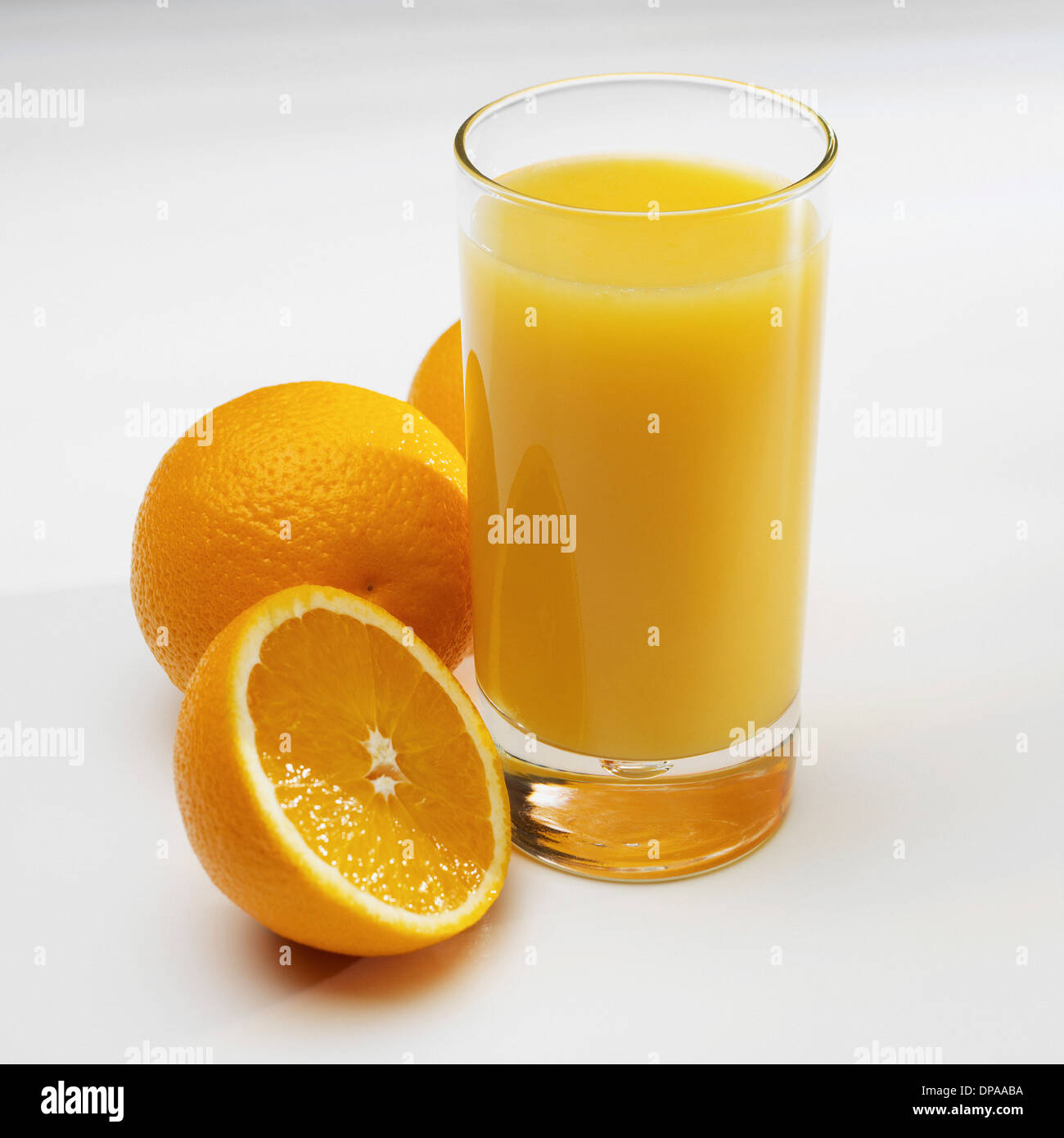 Glass of orange juice with fresh oranges Stock Photo Alamy