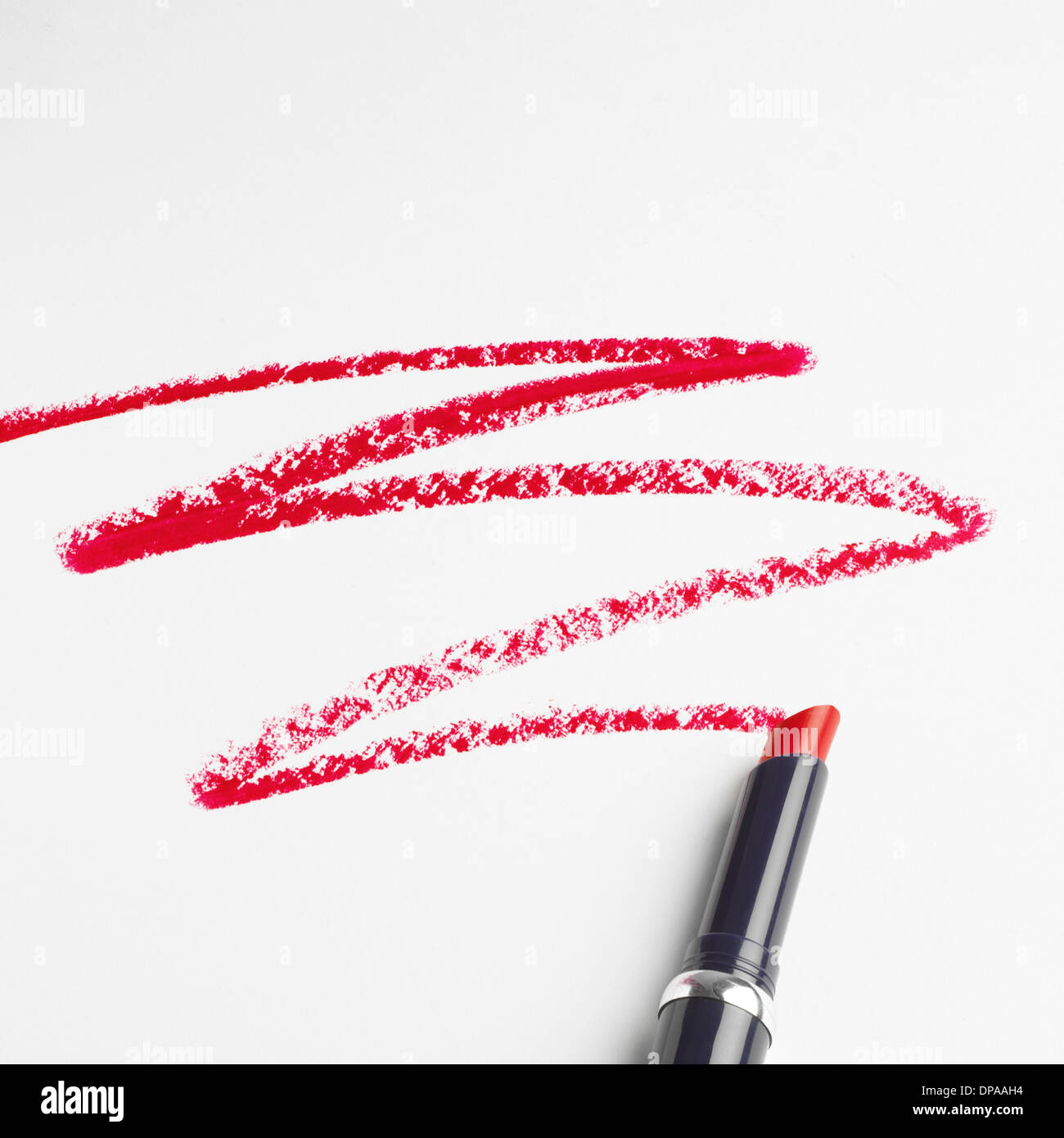 Lipstick zigzag pattern on white background Stock Photo