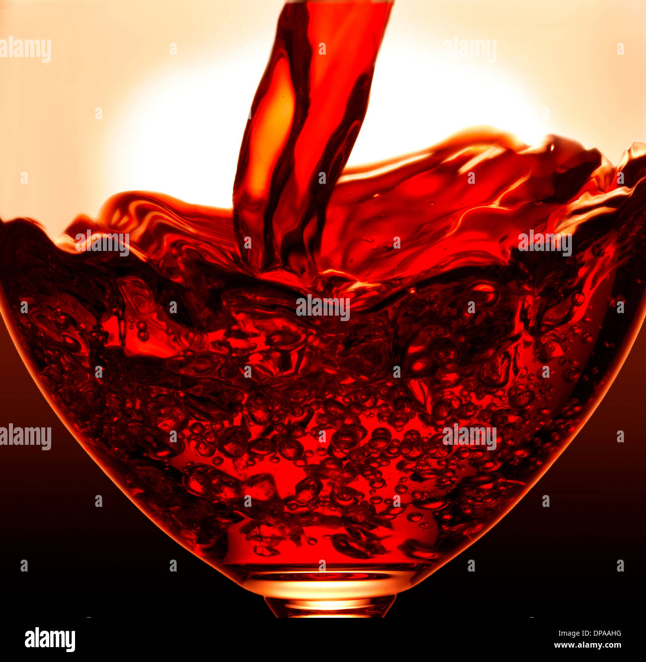 Pouring wine into glass Stock Photo Alamy
