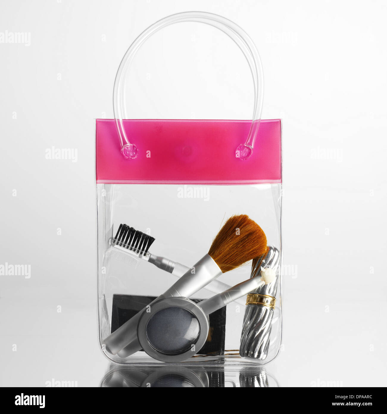 Make up and brushes in transparent bag Stock Photo