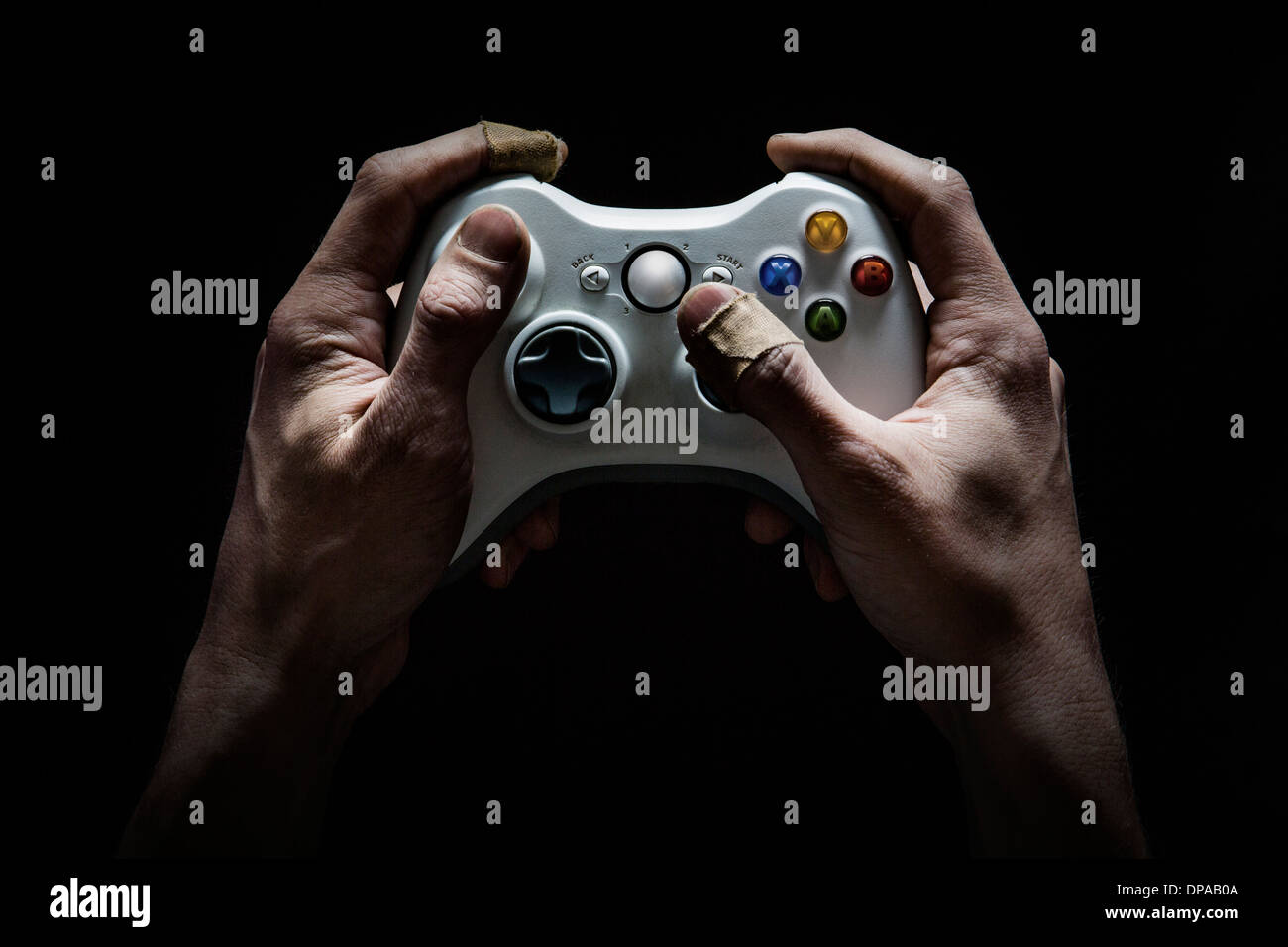 Dirty and damaged hands worn from playing too many computer/video games. Stock Photo