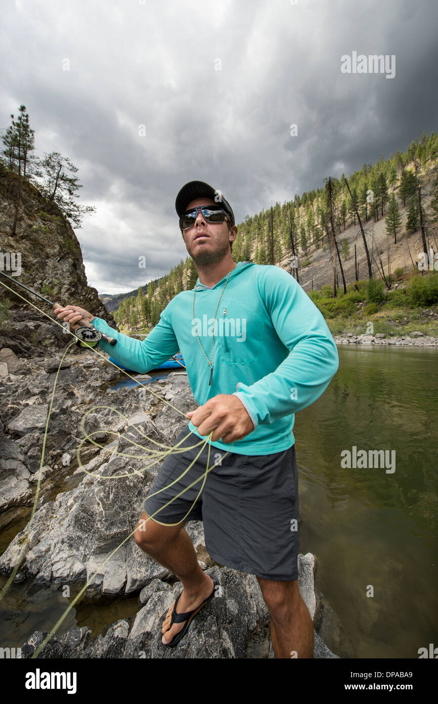 Man fly fishing in the Clark Fork River in Montana. Stock Photo