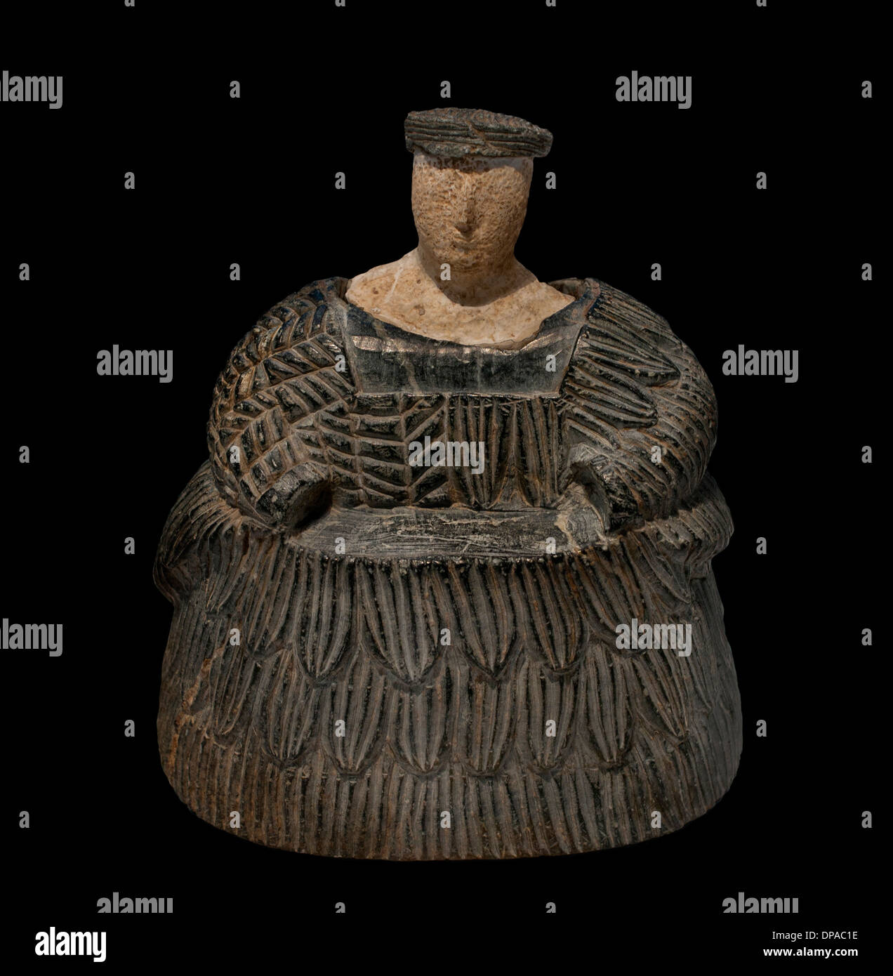 Woman wearing a dress coat wool (kaunakes) protective figure of the living and dead Oxus civilization (Afghanistan) 2300-1700 BC Stock Photo