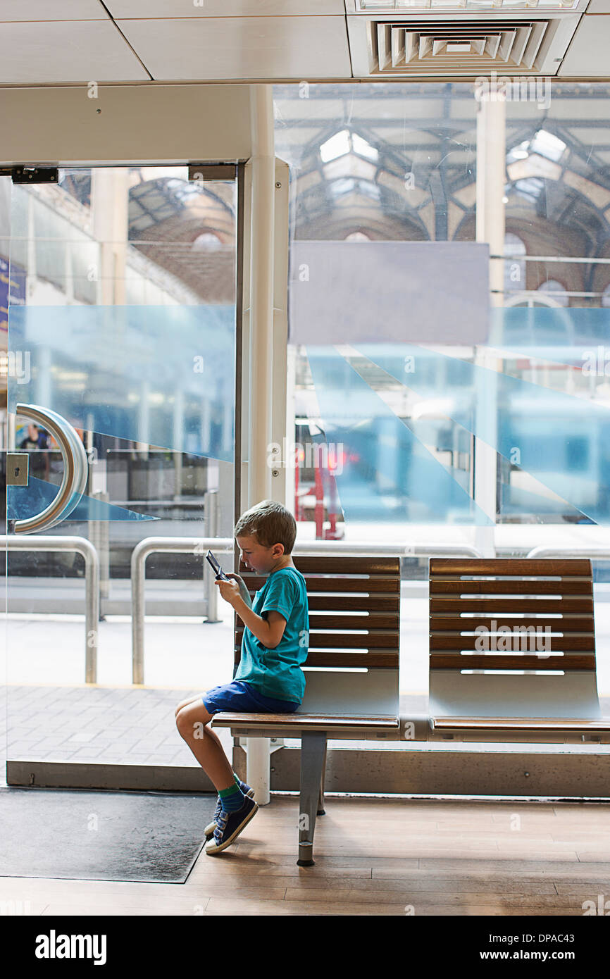 Young boy in train station hires stock photography and images Alamy