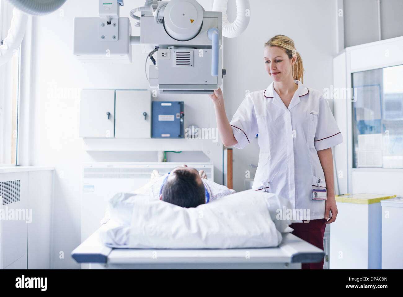 Radiologist scanning patient Stock Photo