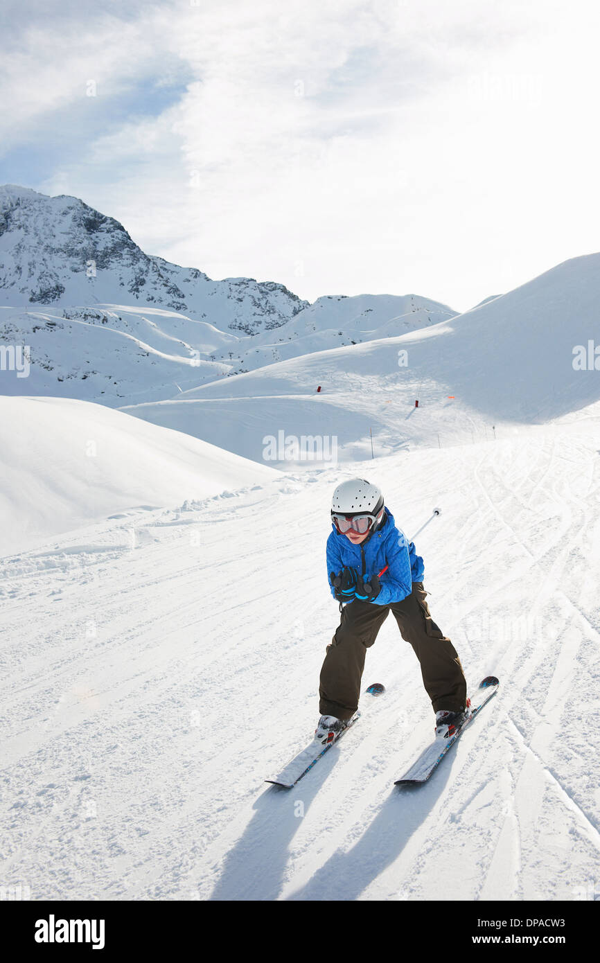 Boy skiing downhill, Les Arcs, Haute-Savoie, France Stock Photo