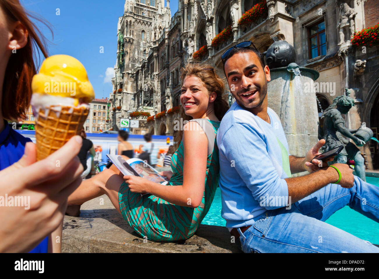 Couple and woman with ice cream, Munich Marienplatz, Munich, Germany Stock Photo