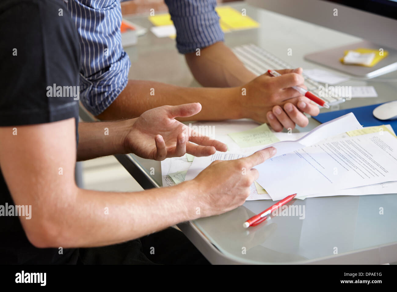 Two men with paperwork, close up Stock Photo