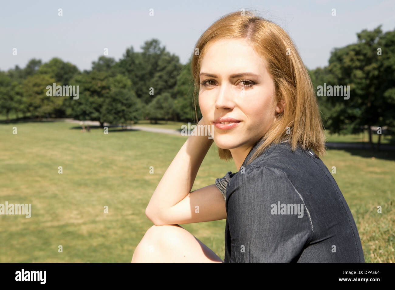Young woman in park Stock Photo
