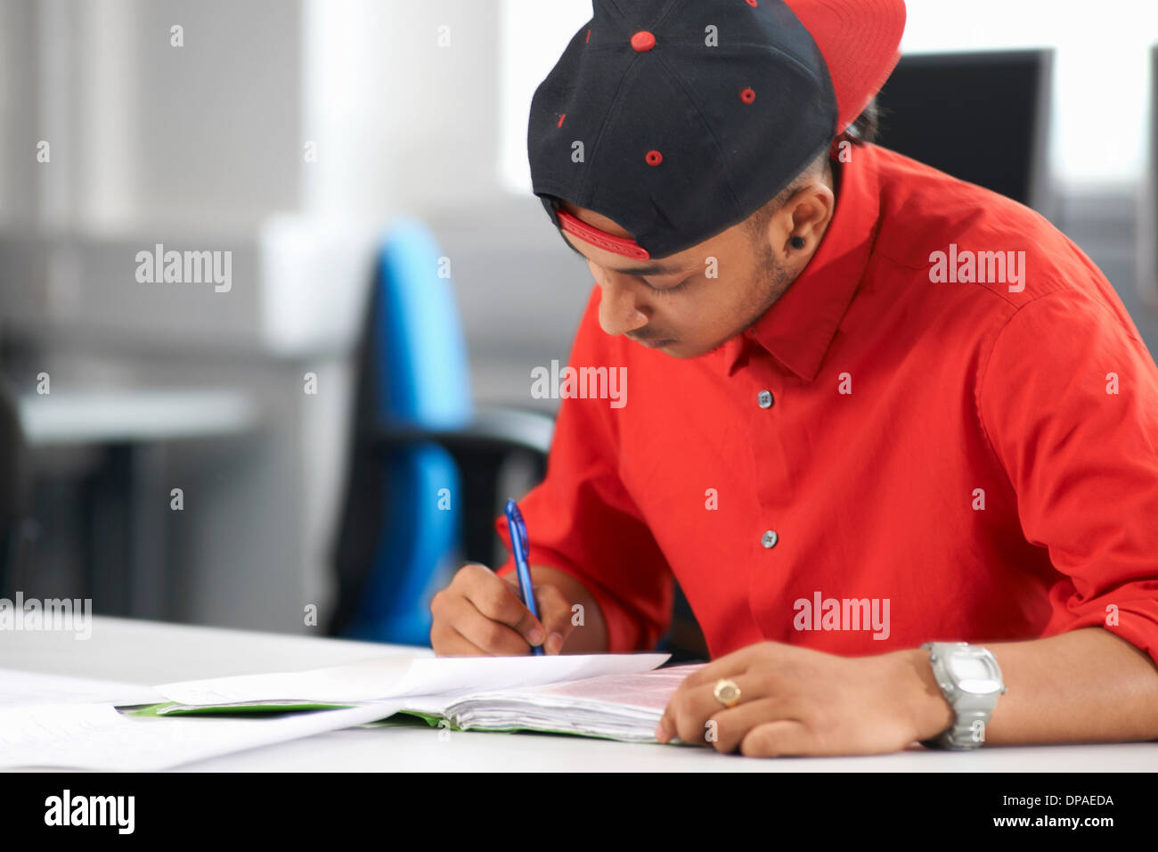Teenage boy studying Stock Photo