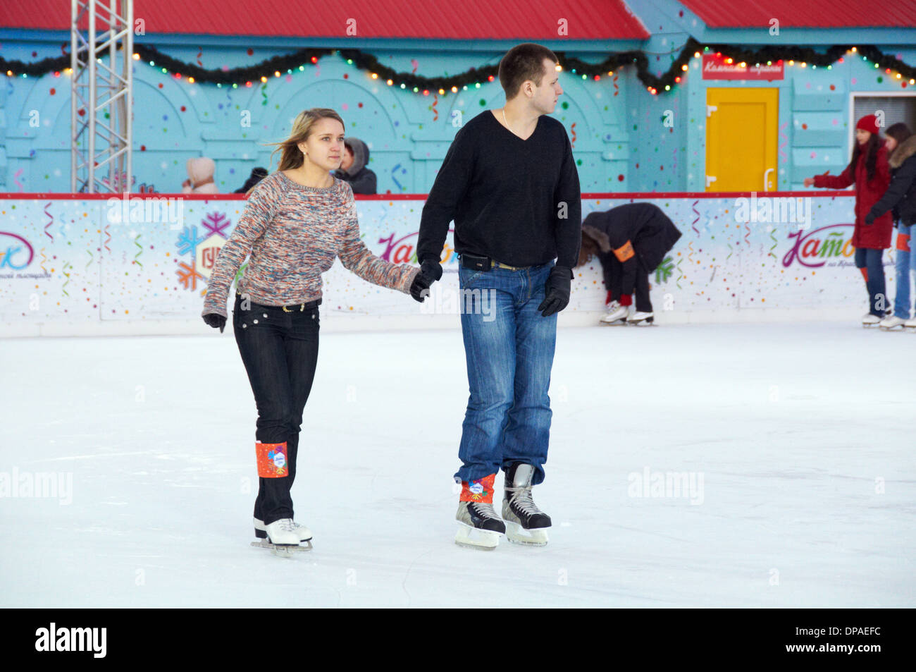 Russian skater couple on the Red Square ice rink Stock Photo