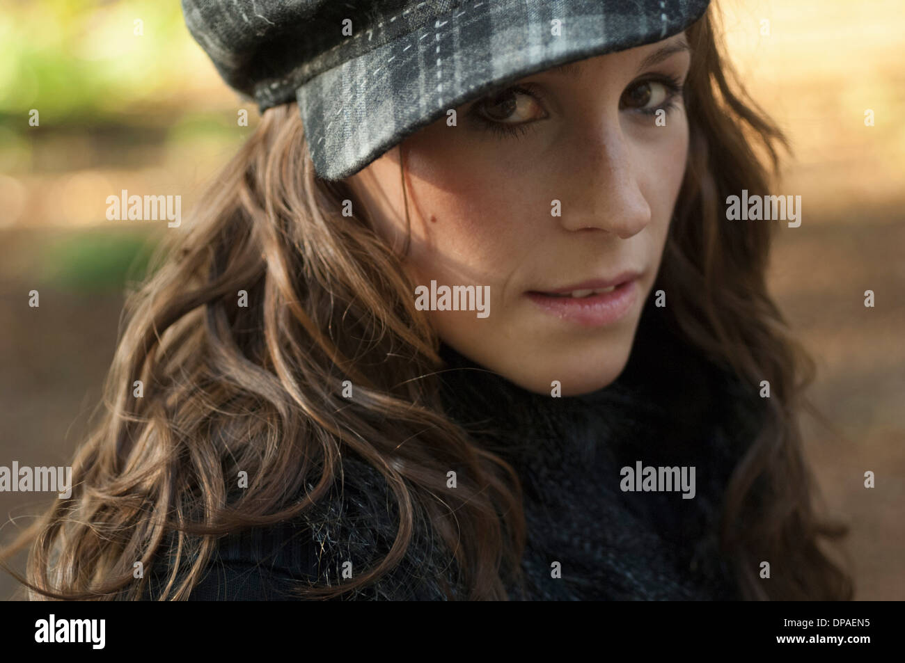 Portrait of young woman wearing hat, close up Stock Photo