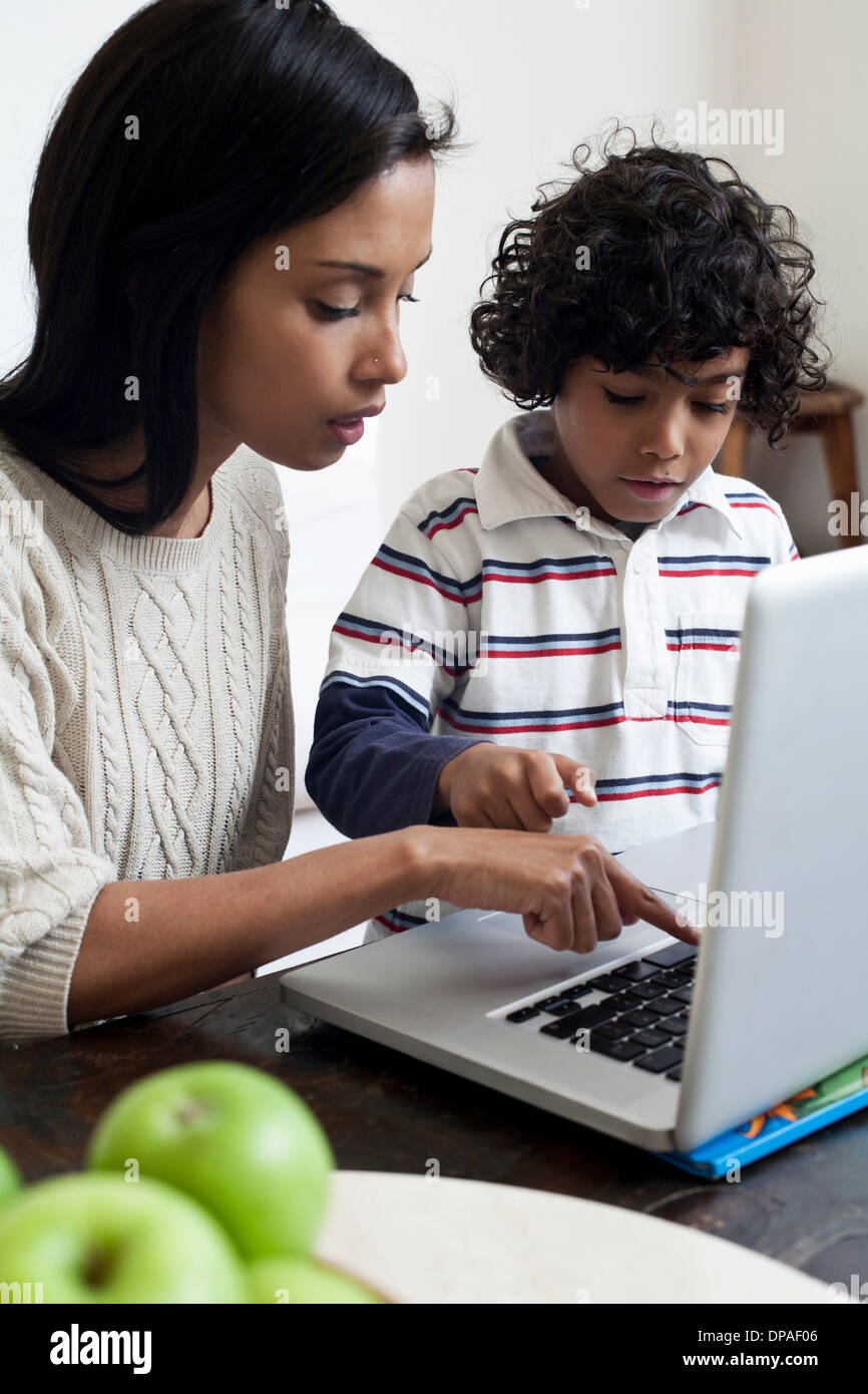 Mother and son using laptop Stock Photo