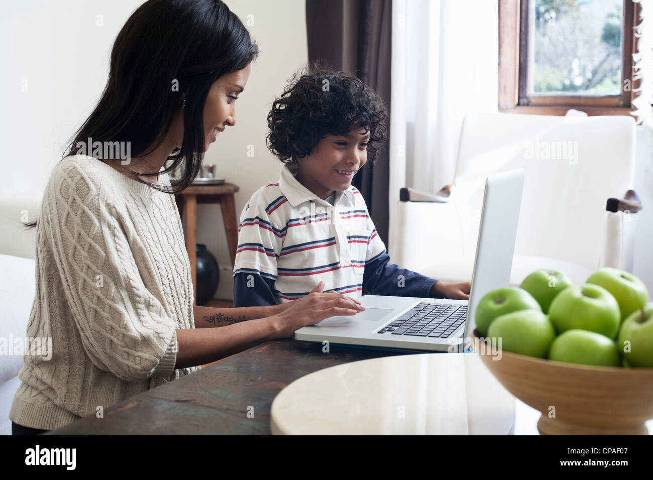 Mother and son using laptop Stock Photo