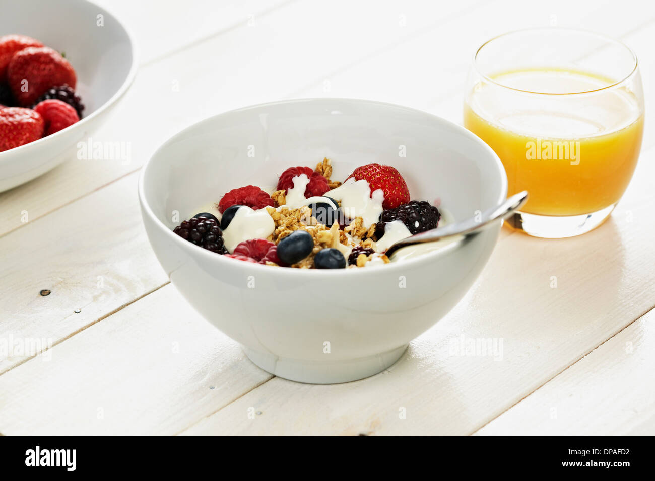 Breakfast cereal with fresh berries and orange juice Stock Photo Alamy