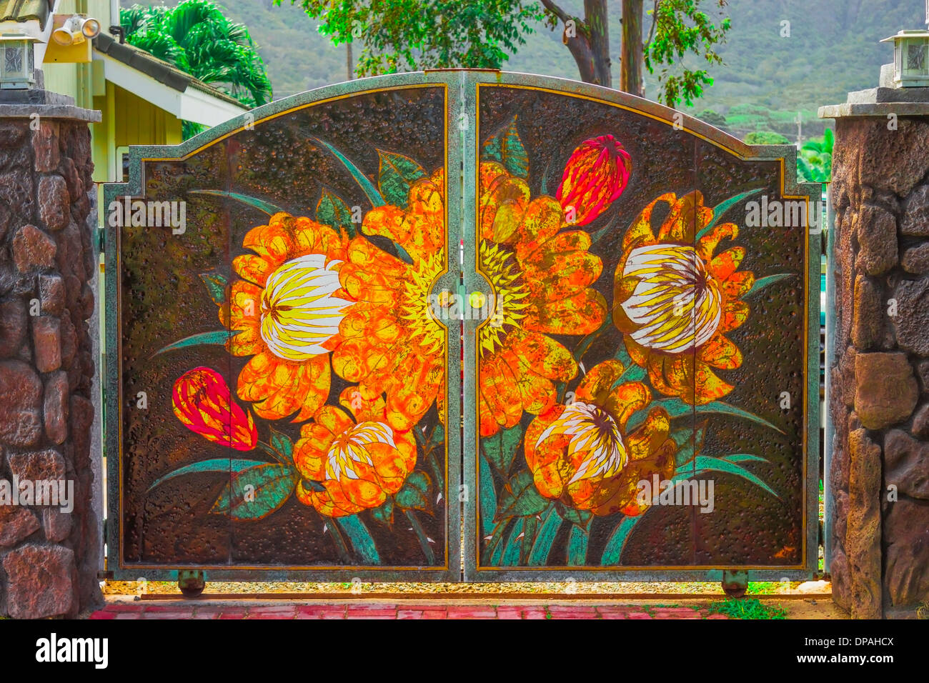 Colorful ornately decorated gate painted with flowers Stock Photo