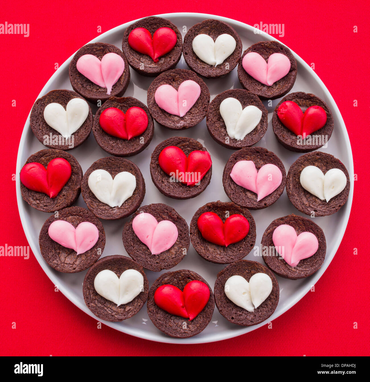 Plate Full Of Mini Fudge Brownies With Red White And Pink Stock