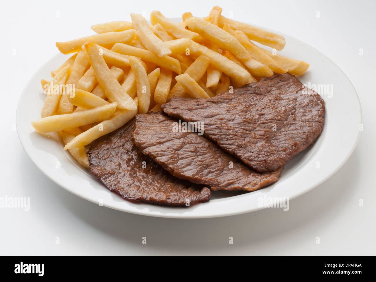 delicious meat dish with fries potatoes Stock Photo