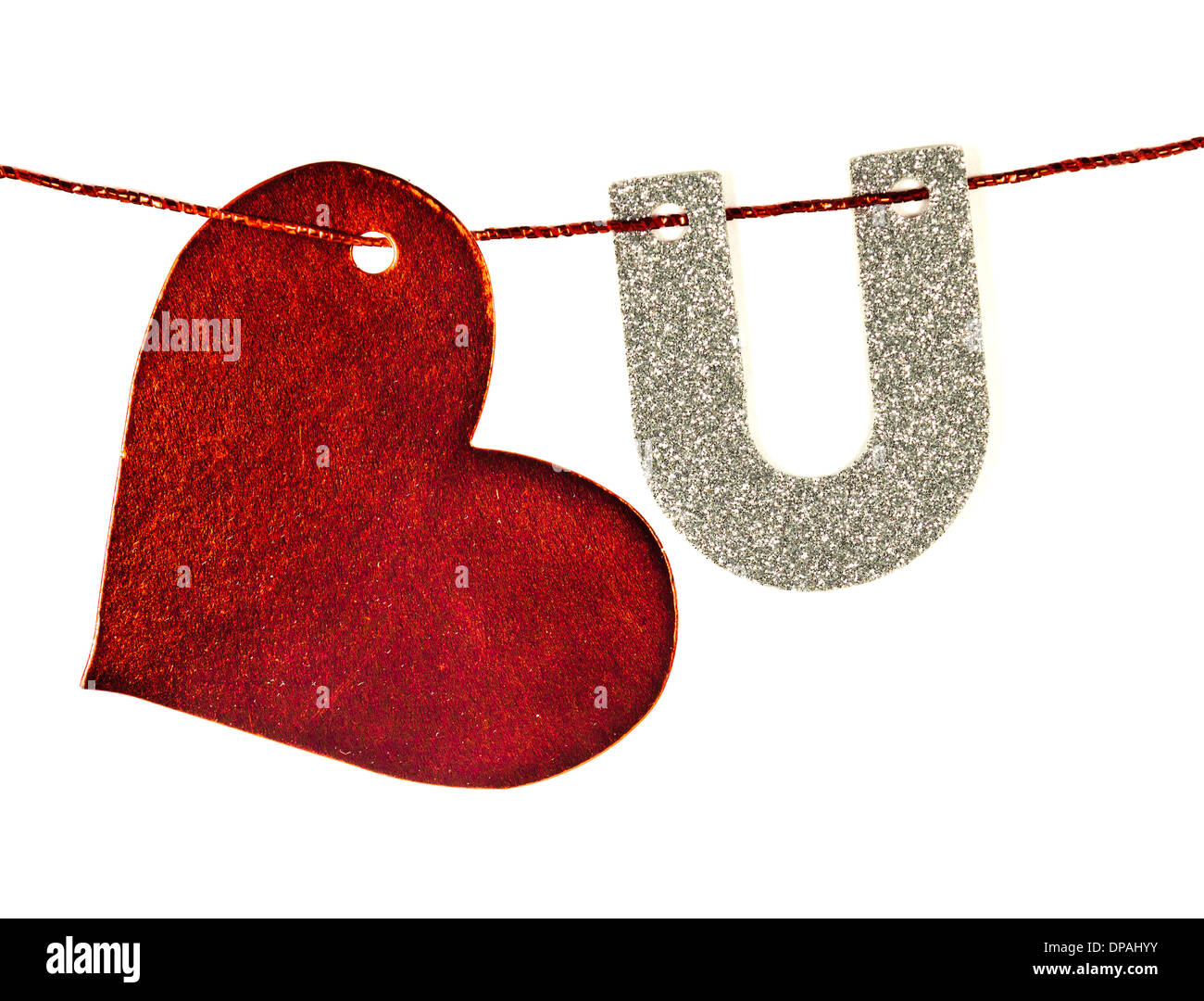 Glittery heart and letter U hanging from a string isolated on ...