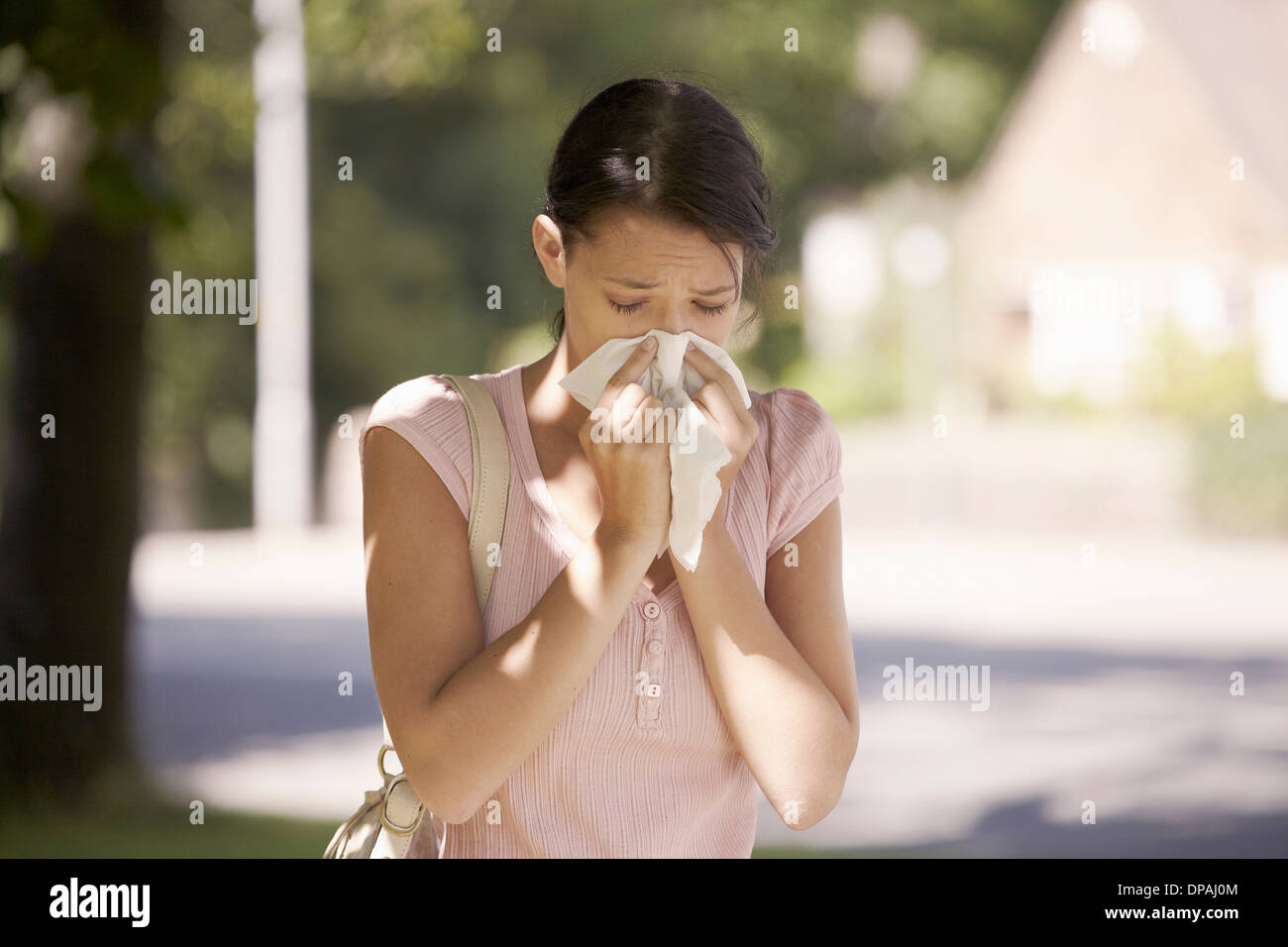 Woman suffering from hay fever Stock Photo