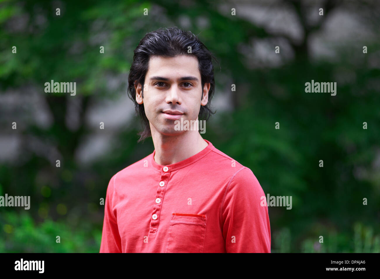 Portrait of young man wearing red top Stock Photo