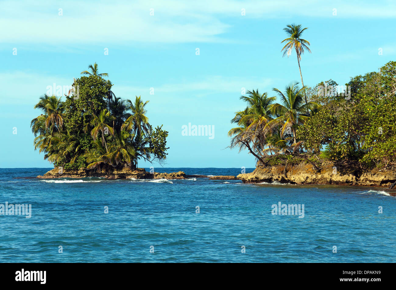 Rocky islet covered by tropical vegetation, Bocas del Toro archipelago, Bastimentos island, Caribbean sea, Panama Stock Photo