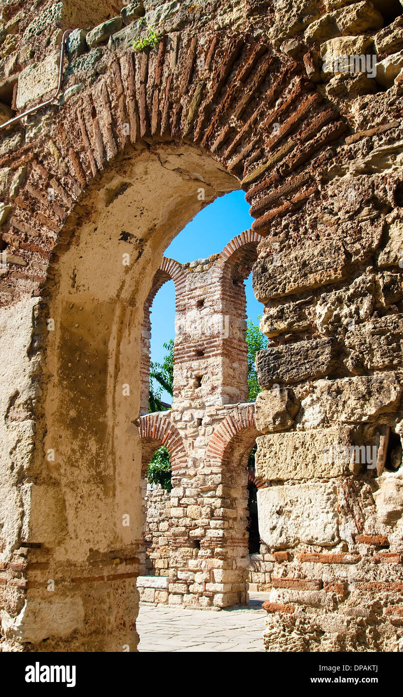 View of the tower of the church of Saint Sophia through the archway. Nessebar. Bulgaria. Stock Photo