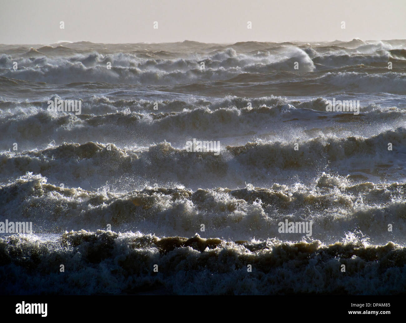 Breakers queue up to hit Brighton beach, Sussex, UK, in the winter storms Stock Photo