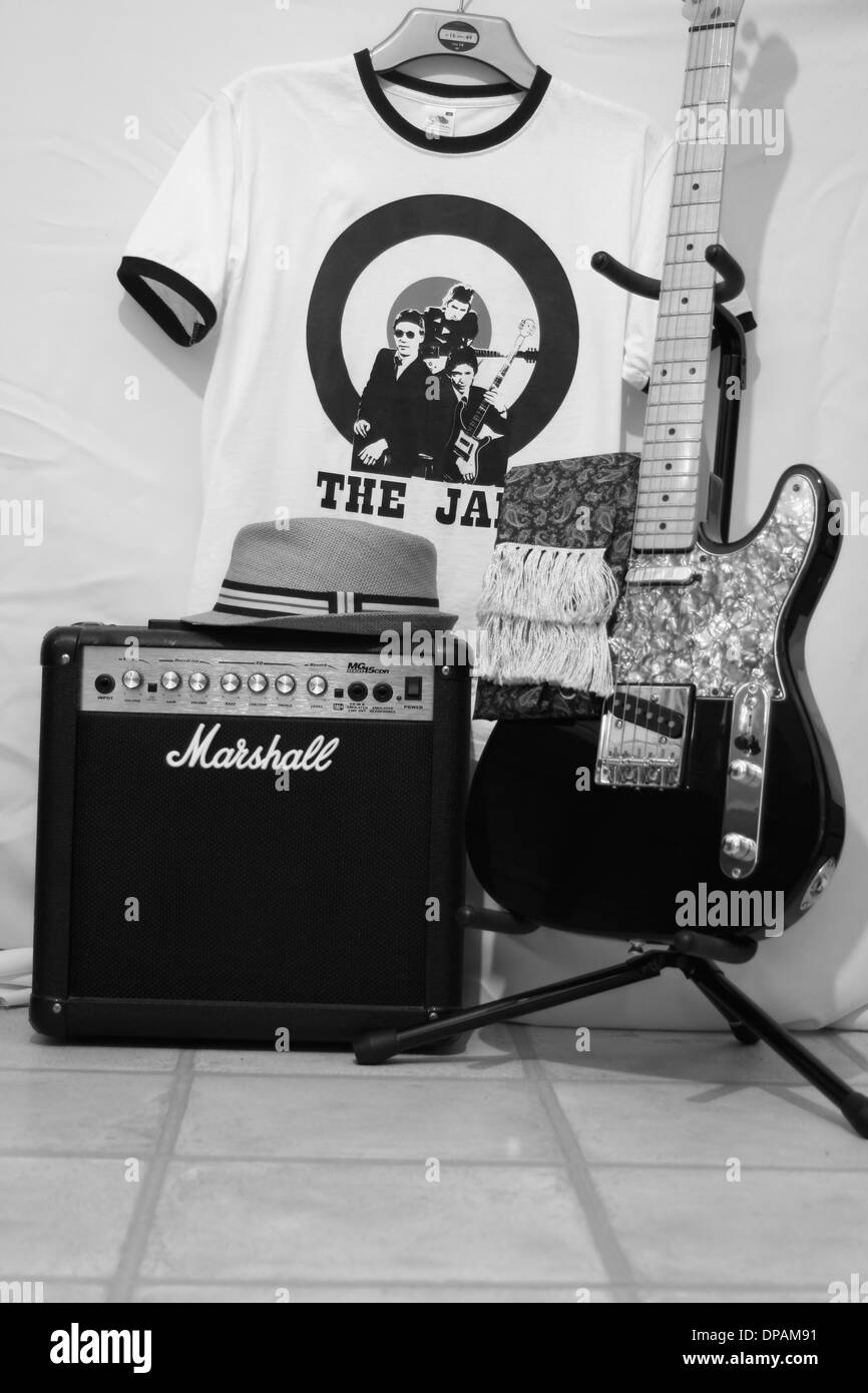 Monochrome image of a electric guitar and practice amp with a Jam t-shirt. Stock Photo
